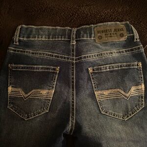 Blue Denim Jeans with Distressed Look and Decorative Stitching